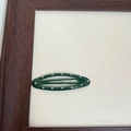 Retro dark green oval metal BB hair clip with white polka dots on a vintage background - Green