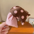 Detailed view of the contrast polka dot bubble cotton fabric hair claw clip texture - Pink