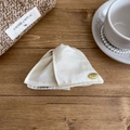 French style shell-shaped hair claw in cream white fabric with a gold metal label - Off-white