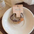 Three colorful telephone wire hair ties with star beads in a decorative ceramic bowl - Three-Piece Set / Coffee Colors
