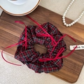 Detail of red and black tartan scrunchie with long silk ribbons on a wooden tray - Red Black Plaid (D)