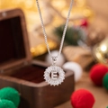 Luxury letter E pendant necklace with clear zircon stones on a silver-tone chain - Letter E