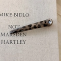 Detail of leopard print tortoiseshell hair clip on a minimalist textured book surface - Light Leopard Thick Straight Style