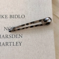 Close-up of translucent leopard print hair clip with tortoiseshell texture on fabric base - Light Leopard Hollow Style
