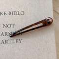 Detail of slim tortoise shell leopard print hair clip with elegant cutout design - Dark Leopard Hollow Style