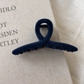 Detail of dark blue flocked matte shark clip showing velvet texture and cross design - Dark Blue
