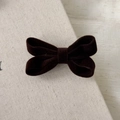 Close-up of a vintage dark brown velvet bow hair clip showing soft fabric texture - Dark Coffee