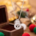 Silver letter V pendant necklace with zircon pavé on round disc and festive background - Letter V