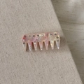 Detail of pink marbled acetate hair comb with sparkling rhinestones on fabric background - Mermaid Pink