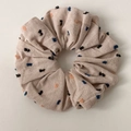 Detailed view of beige cotton linen scrunchie with colorful polka dots and natural texture - Khaki Scrunchie