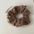 Detailed macro view of dark brown polka dot scrunchie with cream crochet lace edges - Coffee Lace Scrunchie