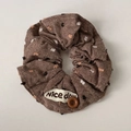 Close-up of brown polka dot scrunchie with a nice day label and decorative button - Coffee Button Scrunchie