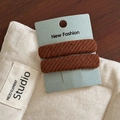 Detail of brown twill fabric hair clips with diagonal texture on card display - Coffee Pair