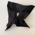 Close-up of handmade black and white striped fabric scrunchie with woven tag - Navy Blue Scarf Scrunchie