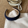 Detail of dark blue twill fabric headband on white knit sweater with vintage decor - Navy Blue