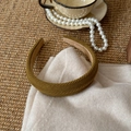 Detail of olive green twill fabric headband with soft non-slip lining and rich texture - Turmeric