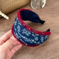 Close-up of bohemian floral wide headband with navy cotton fabric and red crochet edging - Red & Blue Floral Wide