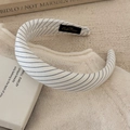 Detail of grey striped padded sponge headband with soft fabric texture and inner brand label - Beige Wide Headband