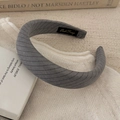 Detail of grey striped wide headband on a white knitted fabric for hair styling - Dark Gray Wide Headband