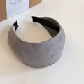 Detail of grey suede headband showing soft textured fabric and black non-slip lining - Gray