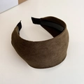 Detail view of wide suede headband in dark olive with non-slip interior lining - Brown