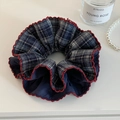 Navy blue plaid oversized scrunchie with red wavy edges on a minimalist white desk - Navy Plaid