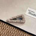 Macro shot of knitted wool triangular hair clip featuring mixed beige and brown yarn texture - Triangle BB Clip / Beige