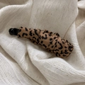 Detailed view of the leopard print fabric texture and pleated design on a banana hair clip - Coffee Leopard