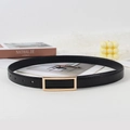 Detailed close-up of a slim black leather belt with golden buckle and fine stitching detail - 105 / Black