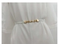 Detail of slim white elastic belt with gold pearl buckle on a white dress - White