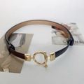 Minimalist slim leather waist belt for dresses with gold toggle buckle on white background - Coffee