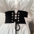 Fashionable black corset belt with silver eyelets and lacing on a white shirt - Black
