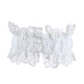 Detailed close-up of white vintage lace embroidery with scalloped edges and dual button closure - Button Decor Style / White