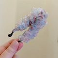 Detailed close-up of floral organza fabric texture on a Korean style hair claw clip - Floral Pink