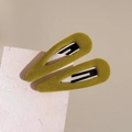 Close-up of olive green and yellow velvet BB hair clips on white cardstock - Ginger Yellow