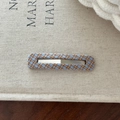 Close-up of a blue and brown plaid fabric hair clip with a stylish rectangular hollow design - Blue and Orange Plaid Square