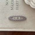 Close-up of a blue and brown plaid fabric hair clip on a natural linen background - Blue and Orange Plaid Oval
