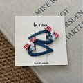 Detail of denim and lace hair clips with red checkered bows on a paper display card - Hollow Triangle Style