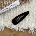 Minimalist dark brown velvet teardrop hair clip for women on a textured cream background - Teardrop / Dark Coffee