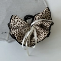 Detail of leopard print bow hair claw with white ribbons and sturdy black plastic clip - Light Coffee Bow Claw Clip