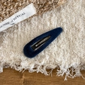 Close-up of a dark blue velvet teardrop hair clip with a matte flocked texture finish - Teardrop / Blue