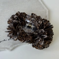 Detail of leopard print fabric flower hair claw clip on a textured beige fabric background - Dark Coffee Claw Clip