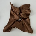 Detail of chocolate brown satin scrunchie with sparkling rhinestones and silk texture - Brown