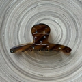 Close-up of tortoise shell pattern hair claw with colorful mini rhinestones inlay - Brown