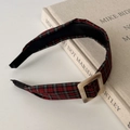 Macro shot of a red plaid headband with a square buckle on a vintage book - Red Plaid Square Buckle Style