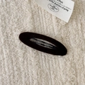 Elegant dark coffee velvet oval BB clip hair accessory on a soft cream fabric base - Oval / Dark Coffee