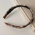 Close-up of vintage plaid headband with anti-slip inner teeth and brown ribbon ends - Gray Coffee Plaid Twist Style