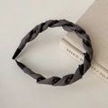 Close-up of dark grey fabric woven headband with non-slip teeth for secure styling - Light Gray