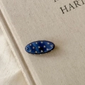 Macro shot of oval dark blue resin hair clip featuring sixteen inlaid sparkling rhinestones - Dark Blue