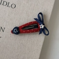 Dettaglio molletta a pois rossi con fiocco blu navy, stella di strass e cuore blu - Clip BB Goccia d'Acqua Traforata Cuore